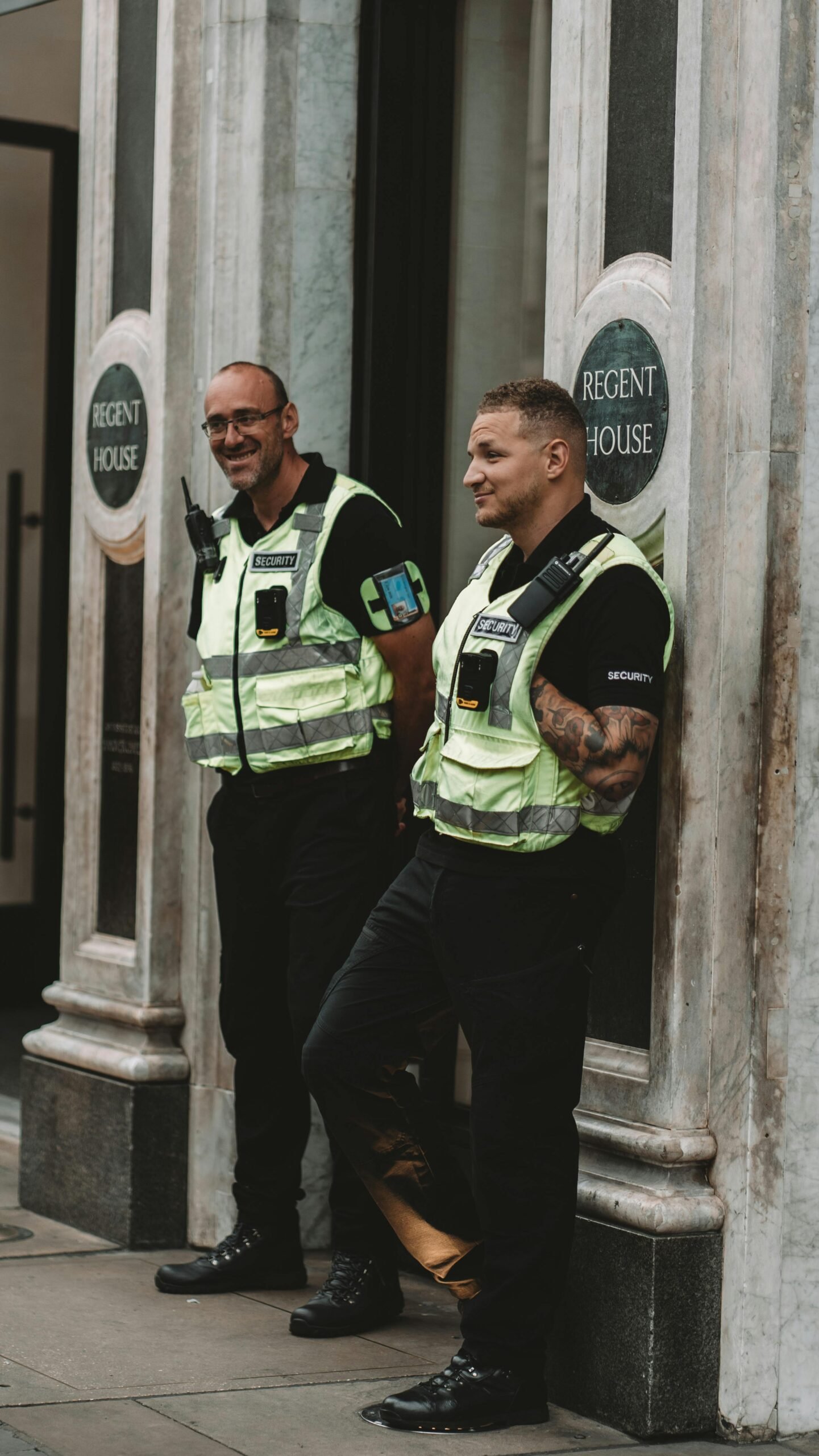 two security guards outside a venue